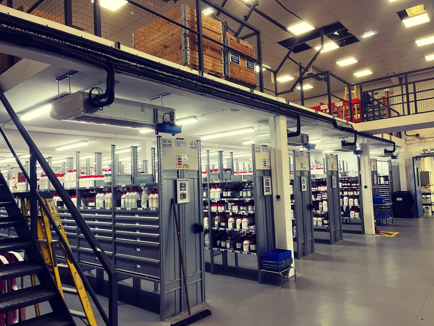 Ceiling-mounted units above the racking bays